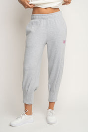 DRESOWE SPODNIE DAMSKIE Z KIESZENIAMI I ZWĘŻANYMI NOGAWKAMI W KOLORZE SZAREGO MELANŻU - SUZIE