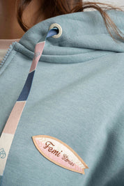 BLUZA Z KAPTUREM ROZPINANA TURKUSOWA - FLEUR