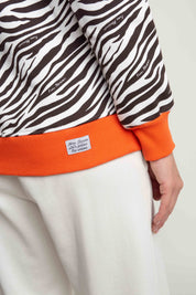 ORANGE/BROWN ZEBRA PRINT HOODIE - CAROL